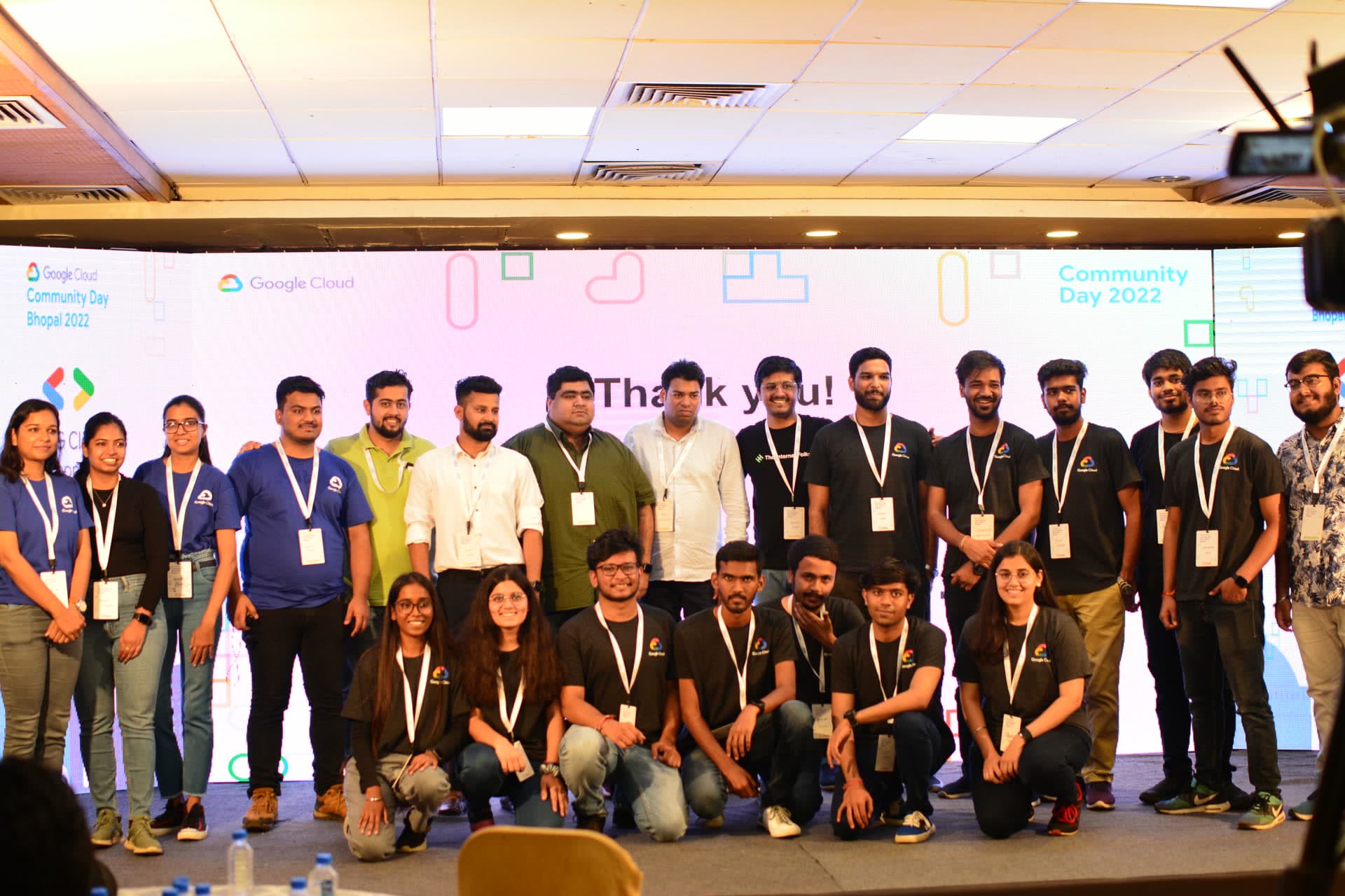 Full crew of volunteers, organizers, and speakers together on stage under the Thank You banner at Cloud Community Day Bhopal 2022
