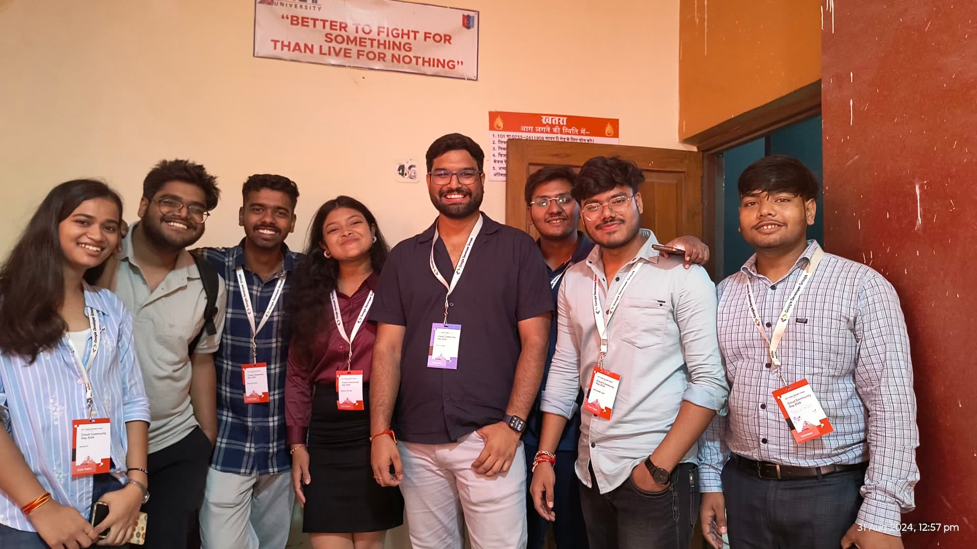 Energetic student volunteers and organizers wearing official event badges at Cloud Community Day Bhopal 2024
